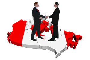 Computer image of two men wearing suits shaking hands while standing on a map of Canada with the Canadian flag on it.